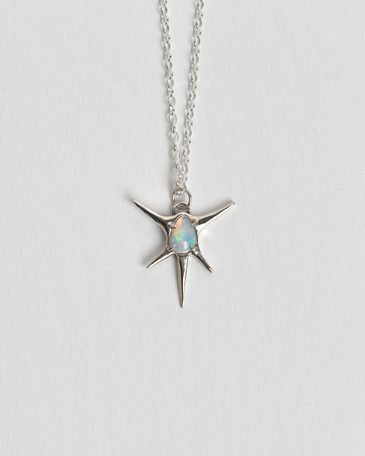 The Opal Light Pendant from Evie Spicer Jewellery comes in recycled sterling silver, front view.