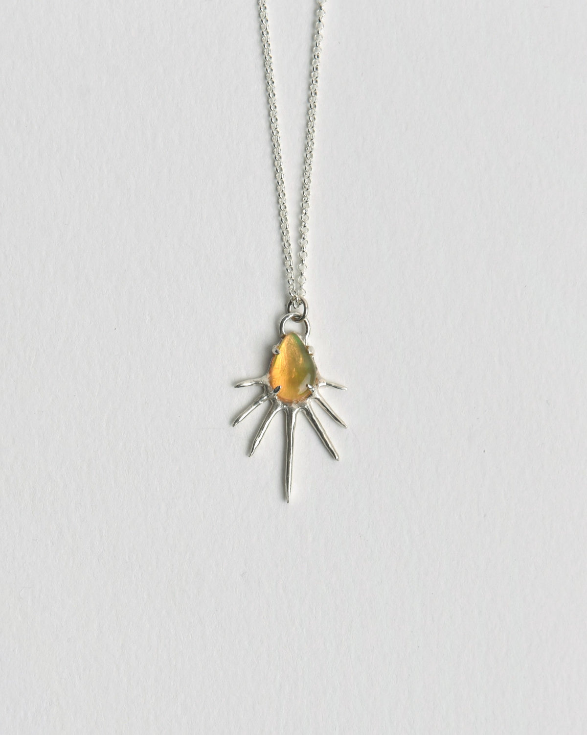 The Sunrise Pendant from Evie Spicer Jewellery comes in recycled sterling silver, front view.