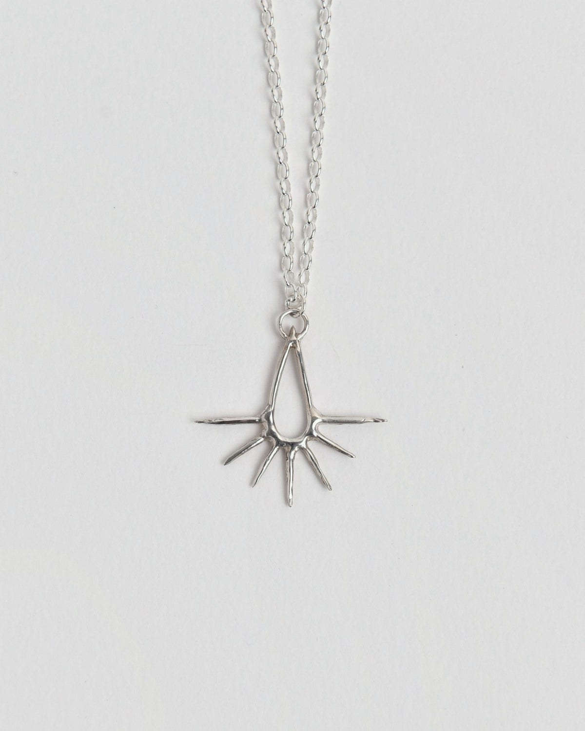 The Water Pendant from Evie Spicer Jewellery comes in recycled sterling silver, front view.